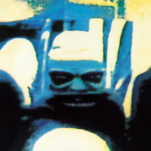 Peter Gabriel album titled "Peter Gabriel IV" aka "Security" A psychedelic, distorted image of a grotesque, monstrous face with glowing eyes and an open mouth. The colors are primarily blue and yellow, with a dark background.